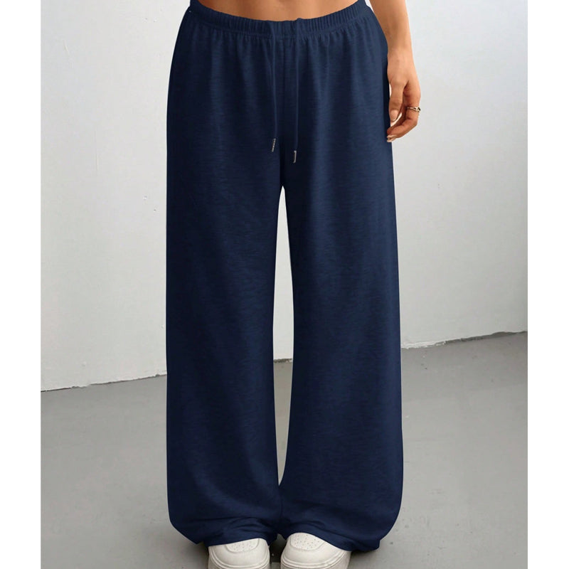 Dammjukisbyxor med hög midja och löst sittande passform – bekväma mjukisbyxor med dragsko, lämpliga både för avkoppling hemma och ute.