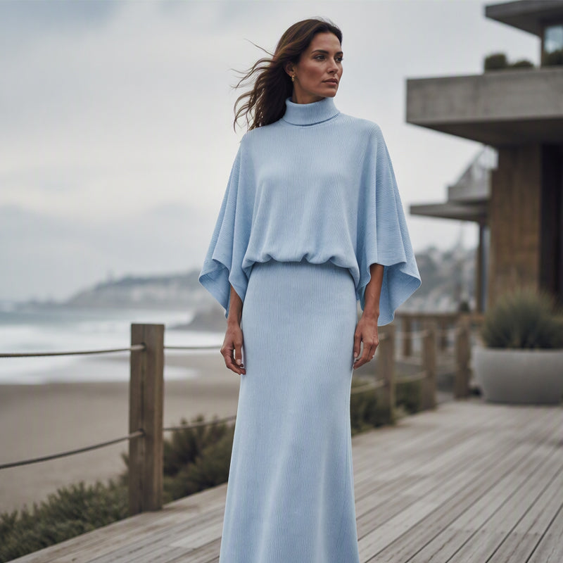 👗 Damkostym, bestående av en topp med fladdermusärmar och en lång kjol